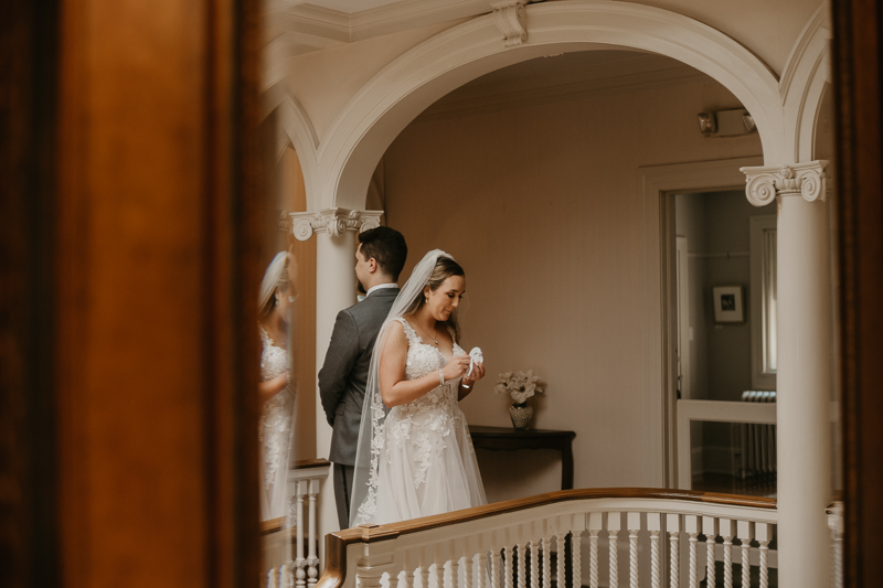 A sentimental bride and groom First Touch at the Liriodendron Mansion in Bel Air, Maryland by Britney Clause Photography