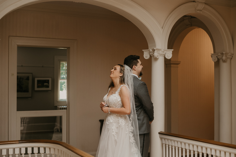 A sentimental bride and groom First Touch at the Liriodendron Mansion in Bel Air, Maryland by Britney Clause Photography