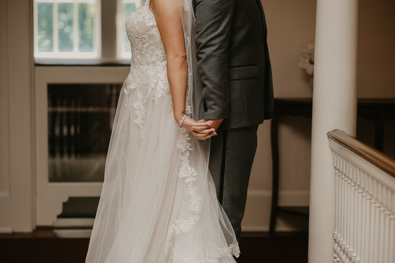 A sentimental bride and groom First Touch at the Liriodendron Mansion in Bel Air, Maryland by Britney Clause Photography