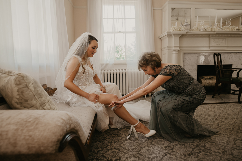 A bride getting ready at the Liriodendron Mansion in Bel Air, Maryland by Britney Clause Photography