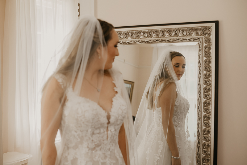 A bride getting ready at the Liriodendron Mansion in Bel Air, Maryland by Britney Clause Photography