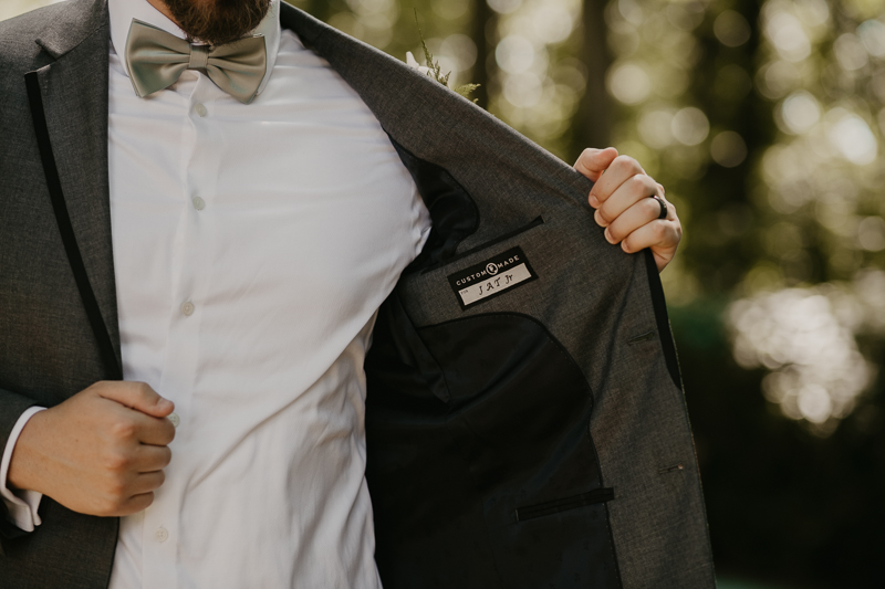 A groom getting ready at the Liriodendron Mansion in Bel Air, Maryland by Britney Clause Photography