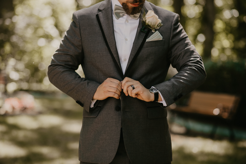 A groom getting ready at the Liriodendron Mansion in Bel Air, Maryland by Britney Clause Photography