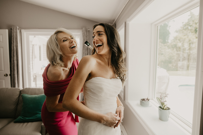 A bride getting ready at a private residence for a William Paca House Wedding in Annapolis, Maryland by Britney Clause Photography