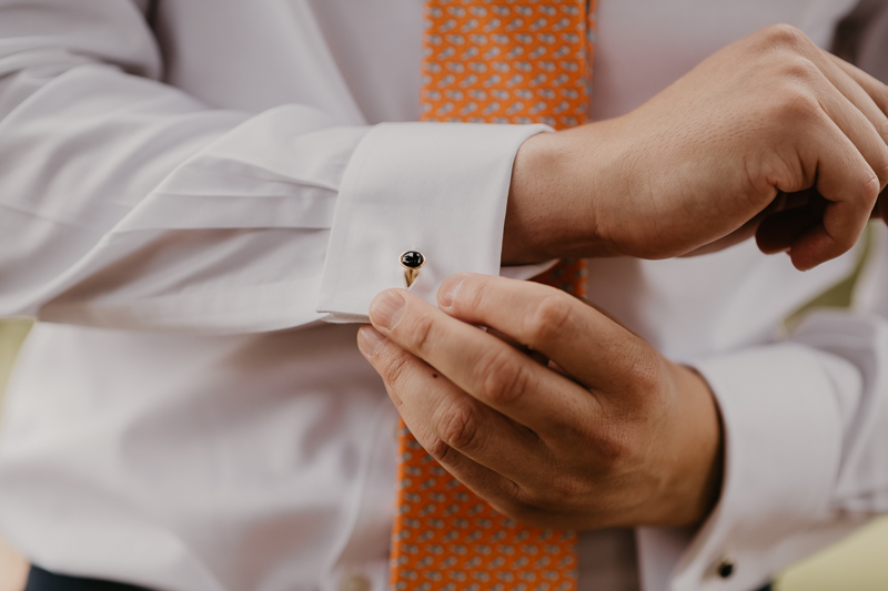 A groom getting ready at the State House for a William Paca House Wedding in Annapolis, Maryland by Britney Clause Photography