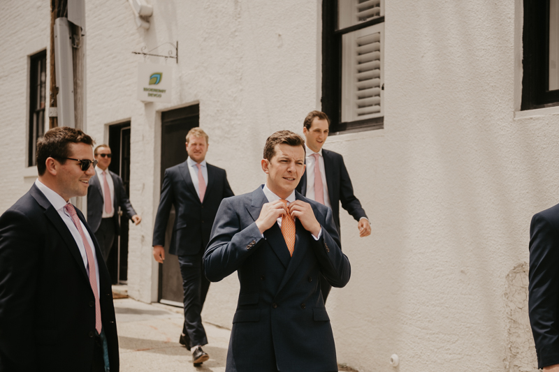 A groom getting ready at the State House for a William Paca House Wedding in Annapolis, Maryland by Britney Clause Photography