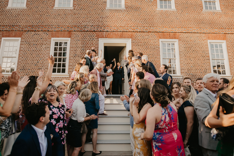 A high energy wedding march through the streets of Annapolis, Maryland by Naptown Brass Band from the William Paca House to Ego Alley by Britney Clause Photography