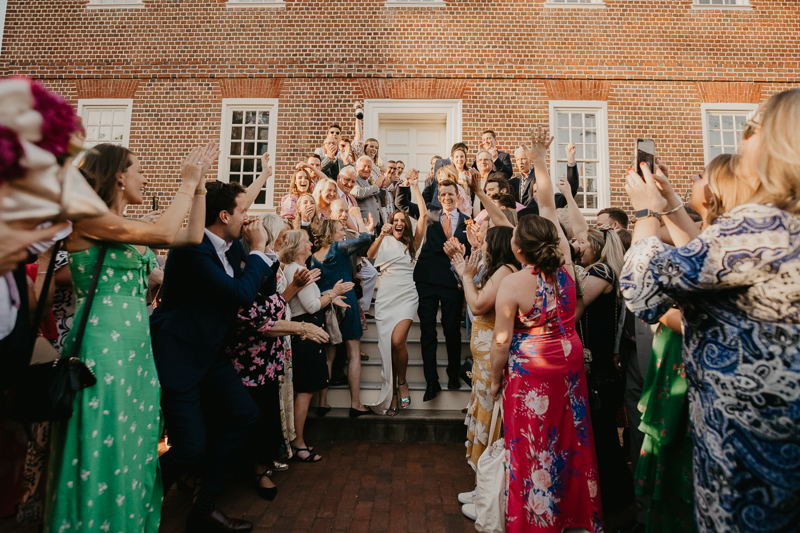 A high energy wedding march through the streets of Annapolis, Maryland by Naptown Brass Band from the William Paca House to Ego Alley by Britney Clause Photography