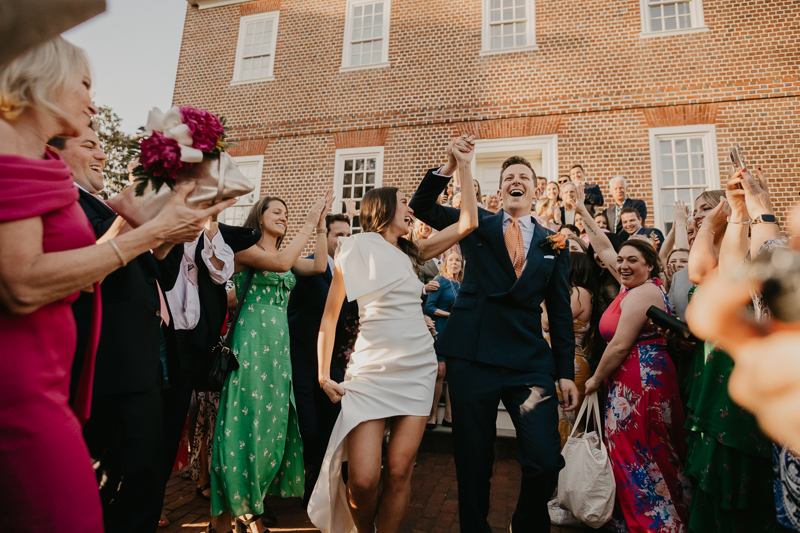 A high energy wedding march through the streets of Annapolis, Maryland by Naptown Brass Band from the William Paca House to Ego Alley by Britney Clause Photography