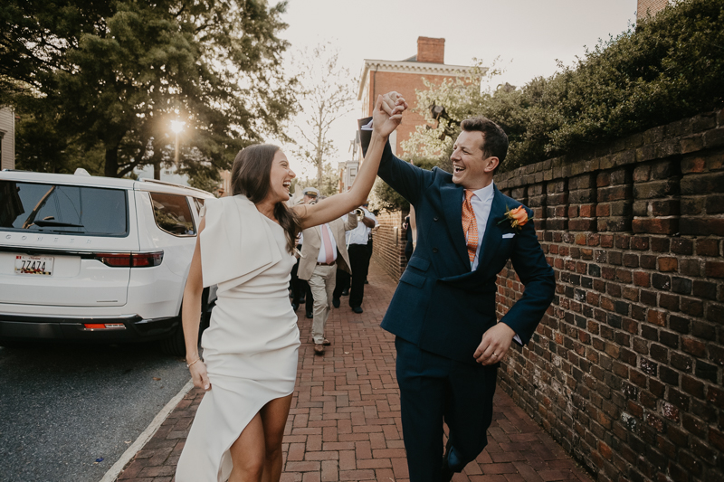A high energy wedding march through the streets of Annapolis, Maryland by Naptown Brass Band from the William Paca House to Ego Alley by Britney Clause Photography
