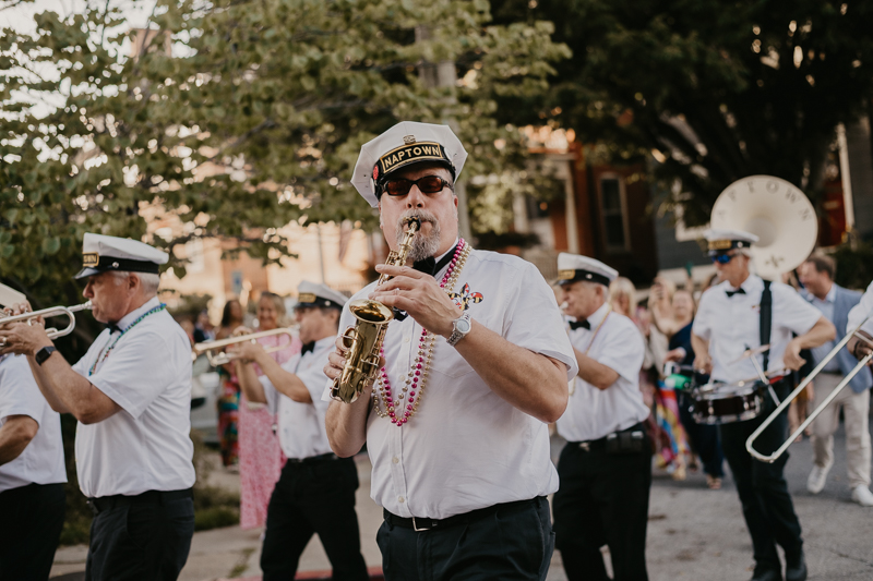 A high energy wedding march through the streets of Annapolis, Maryland by Naptown Brass Band from the William Paca House to Ego Alley by Britney Clause Photography