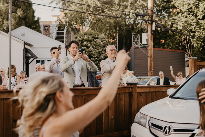 A high energy wedding march through the streets of Annapolis, Maryland by Naptown Brass Band from the William Paca House to Ego Alley by Britney Clause Photography