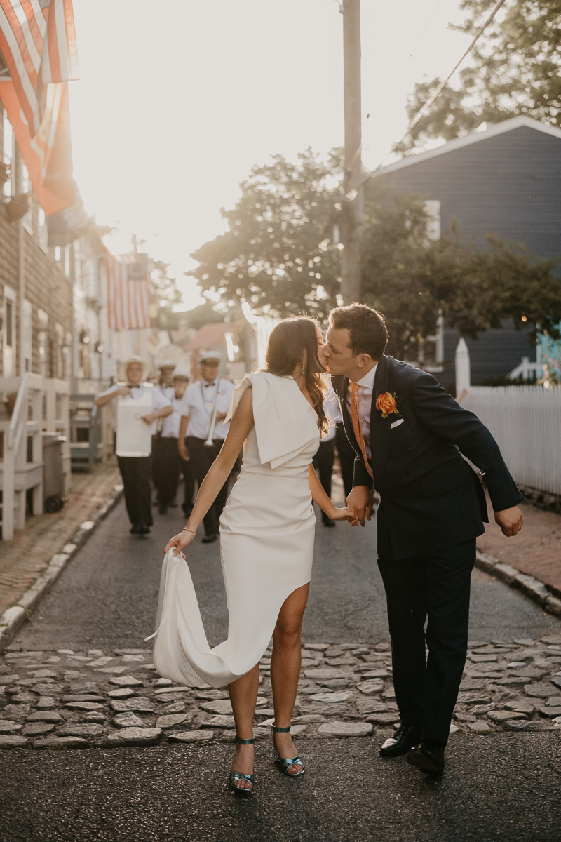 A high energy wedding march through the streets of Annapolis, Maryland by Naptown Brass Band from the William Paca House to Ego Alley by Britney Clause Photography