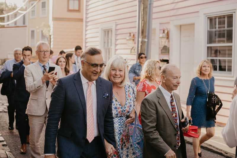 A high energy wedding march through the streets of Annapolis, Maryland by Naptown Brass Band from the William Paca House to Ego Alley by Britney Clause Photography