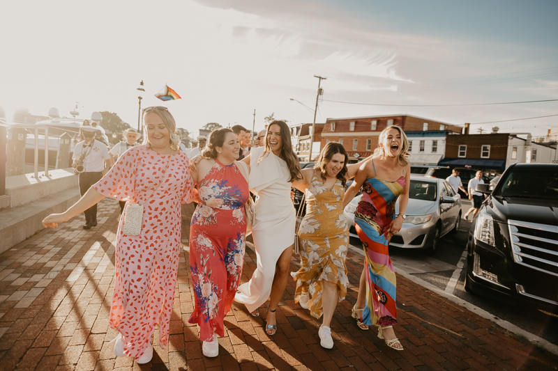 A high energy wedding march through the streets of Annapolis, Maryland by Naptown Brass Band from the William Paca House to Ego Alley by Britney Clause Photography