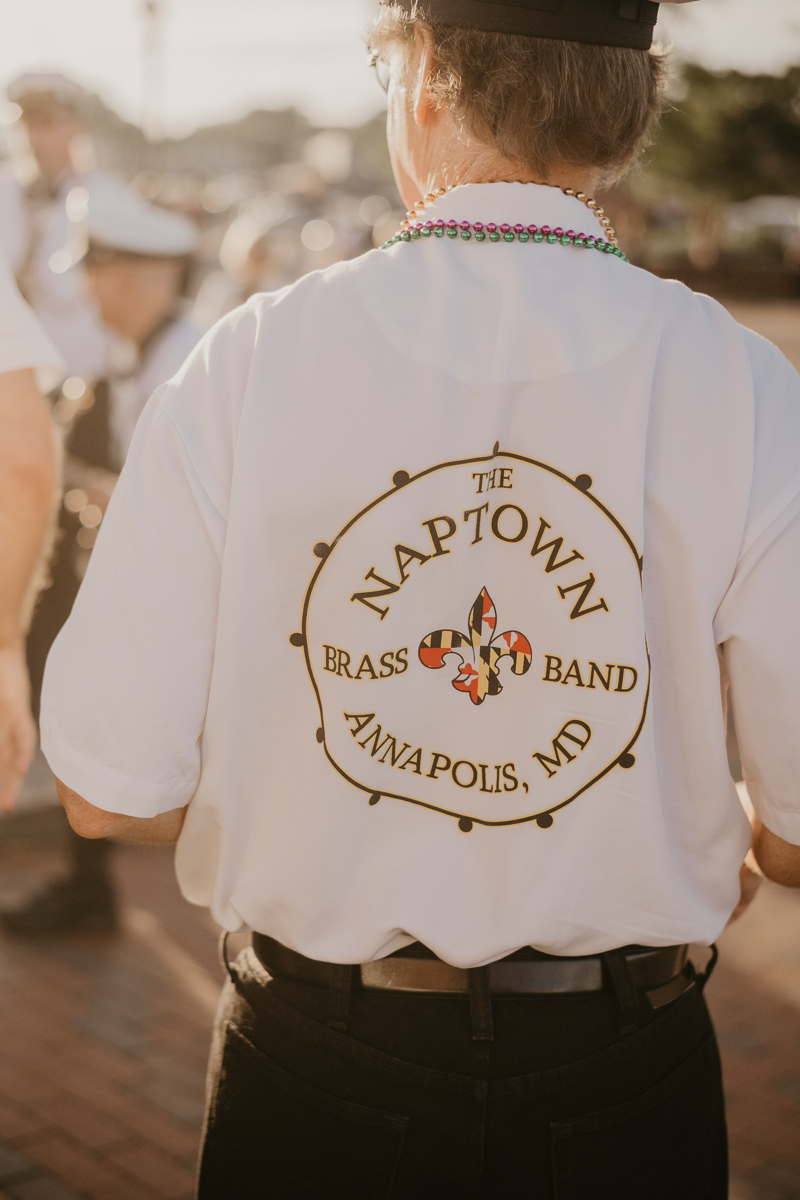 A high energy wedding march through the streets of Annapolis, Maryland by Naptown Brass Band from the William Paca House to Ego Alley by Britney Clause Photography