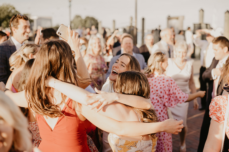 A high energy wedding march through the streets of Annapolis, Maryland by Naptown Brass Band from the William Paca House to Ego Alley by Britney Clause Photography