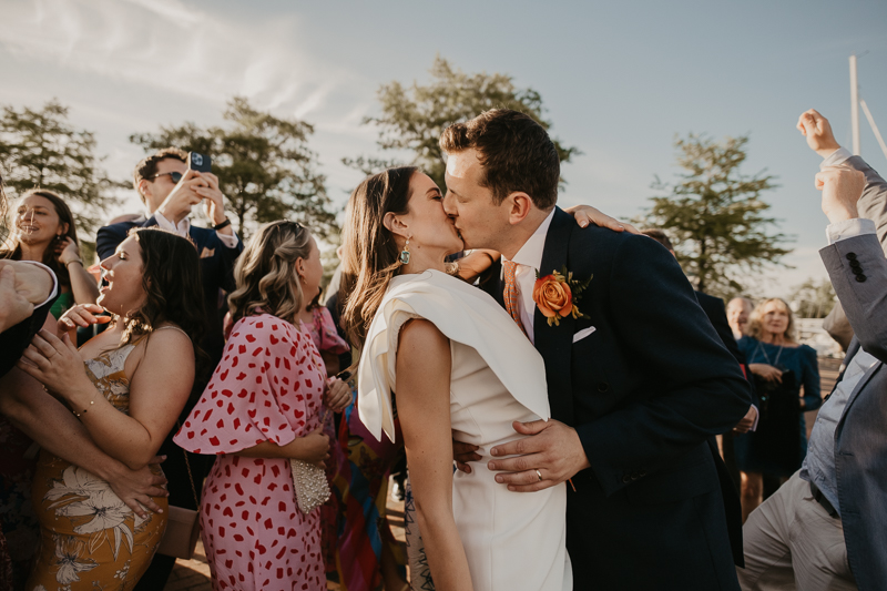 A high energy wedding march through the streets of Annapolis, Maryland by Naptown Brass Band from the William Paca House to Ego Alley by Britney Clause Photography