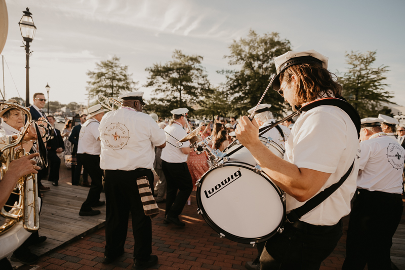 A high energy wedding march through the streets of Annapolis, Maryland by Naptown Brass Band from the William Paca House to Ego Alley by Britney Clause Photography