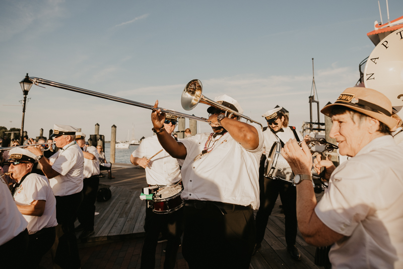 A high energy wedding march through the streets of Annapolis, Maryland by Naptown Brass Band from the William Paca House to Ego Alley by Britney Clause Photography