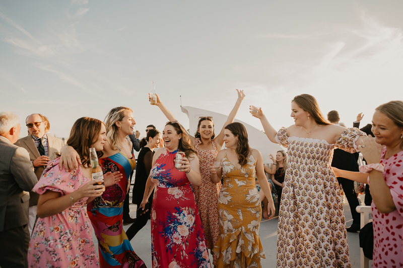 An exciting evening wedding reception by Watershed Entertainment and Timmie Metz Band on the Harbor Queen boat in Annapolis, Maryland by Britney Clause Photography