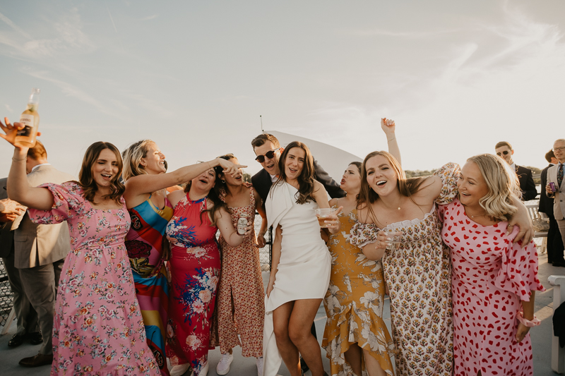 An exciting evening wedding reception by Watershed Entertainment and Timmie Metz Band on the Harbor Queen boat in Annapolis, Maryland by Britney Clause Photography