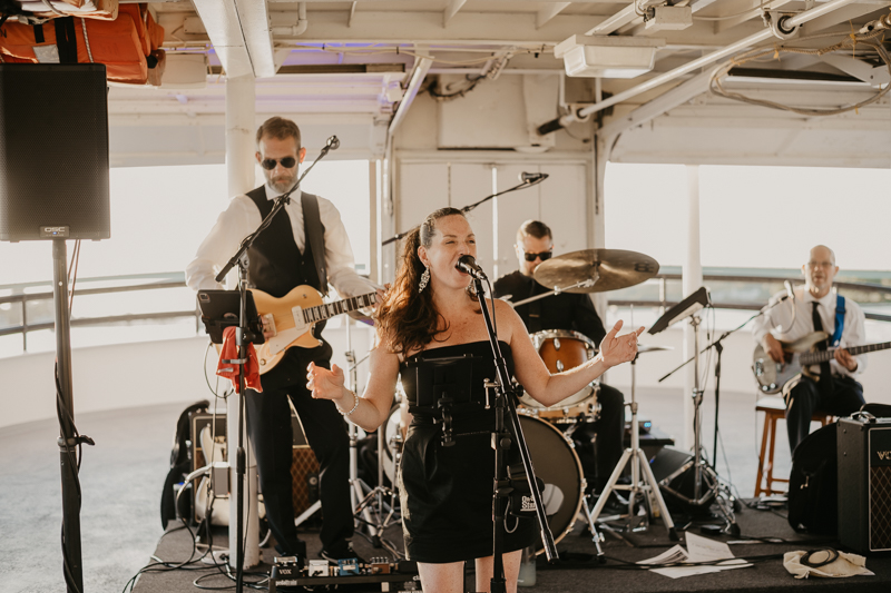 An exciting evening wedding reception by Watershed Entertainment and Timmie Metz Band on the Harbor Queen boat in Annapolis, Maryland by Britney Clause Photography