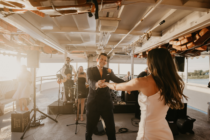 An exciting evening wedding reception by Watershed Entertainment and Timmie Metz Band on the Harbor Queen boat in Annapolis, Maryland by Britney Clause Photography