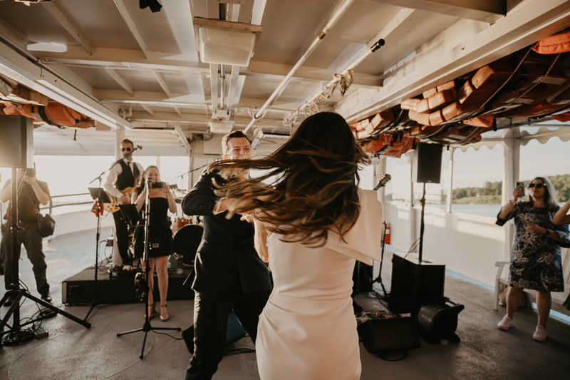 An exciting evening wedding reception by Watershed Entertainment and Timmie Metz Band on the Harbor Queen boat in Annapolis, Maryland by Britney Clause Photography