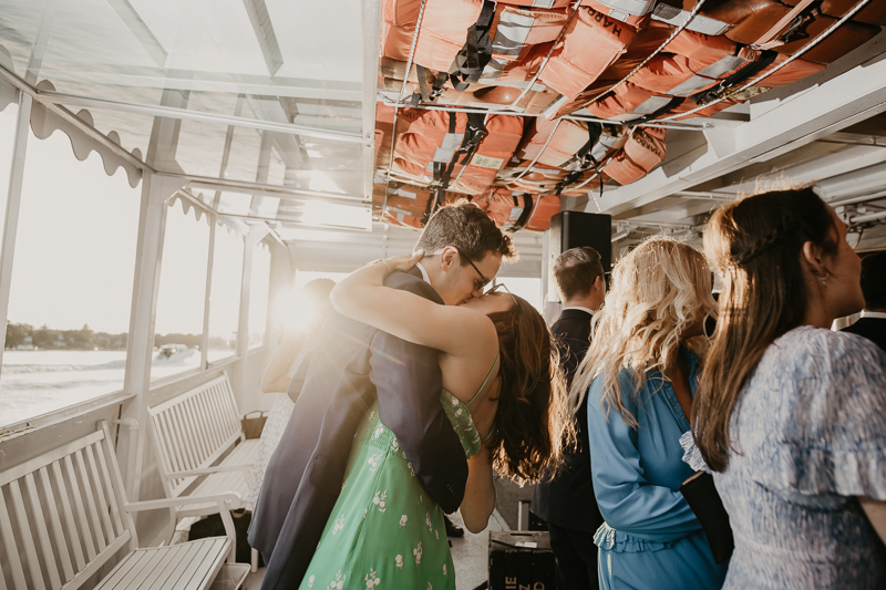 An exciting evening wedding reception by Watershed Entertainment and Timmie Metz Band on the Harbor Queen boat in Annapolis, Maryland by Britney Clause Photography