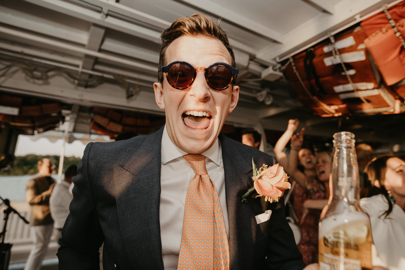 An exciting evening wedding reception by Watershed Entertainment and Timmie Metz Band on the Harbor Queen boat in Annapolis, Maryland by Britney Clause Photography