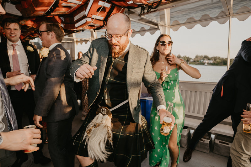 An exciting evening wedding reception by Watershed Entertainment and Timmie Metz Band on the Harbor Queen boat in Annapolis, Maryland by Britney Clause Photography