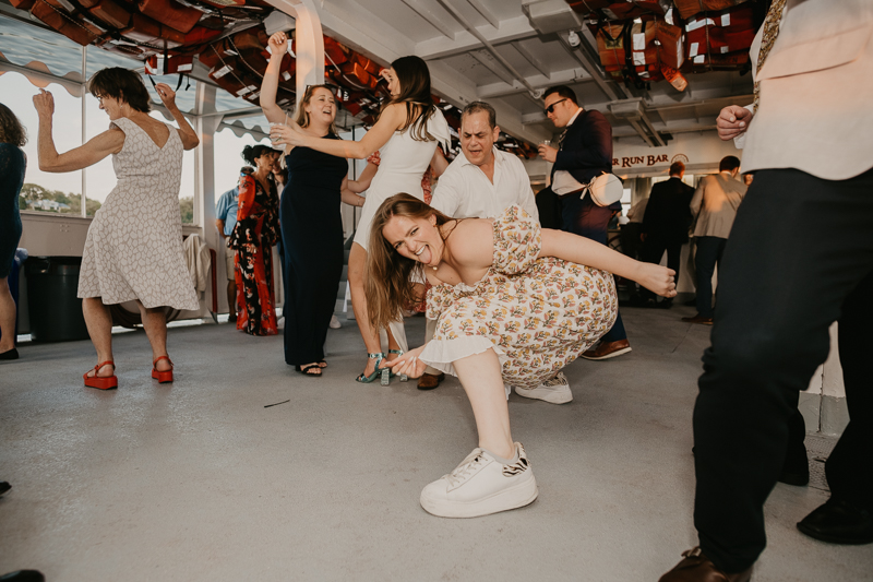 An exciting evening wedding reception by Watershed Entertainment and Timmie Metz Band on the Harbor Queen boat in Annapolis, Maryland by Britney Clause Photography