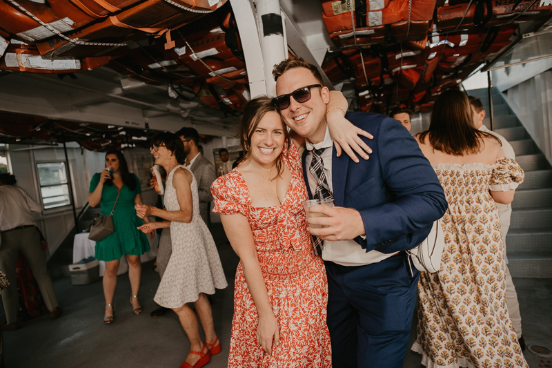 An exciting evening wedding reception by Watershed Entertainment and Timmie Metz Band on the Harbor Queen boat in Annapolis, Maryland by Britney Clause Photography