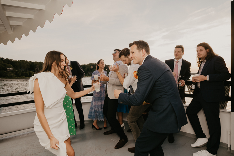 An exciting evening wedding reception by Watershed Entertainment and Timmie Metz Band on the Harbor Queen boat in Annapolis, Maryland by Britney Clause Photography