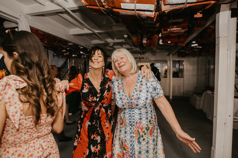 An exciting evening wedding reception by Watershed Entertainment and Timmie Metz Band on the Harbor Queen boat in Annapolis, Maryland by Britney Clause Photography