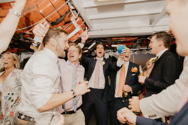 An exciting evening wedding reception by Watershed Entertainment and Timmie Metz Band on the Harbor Queen boat in Annapolis, Maryland by Britney Clause Photography