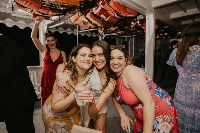 An exciting evening wedding reception by Watershed Entertainment and Timmie Metz Band on the Harbor Queen boat in Annapolis, Maryland by Britney Clause Photography