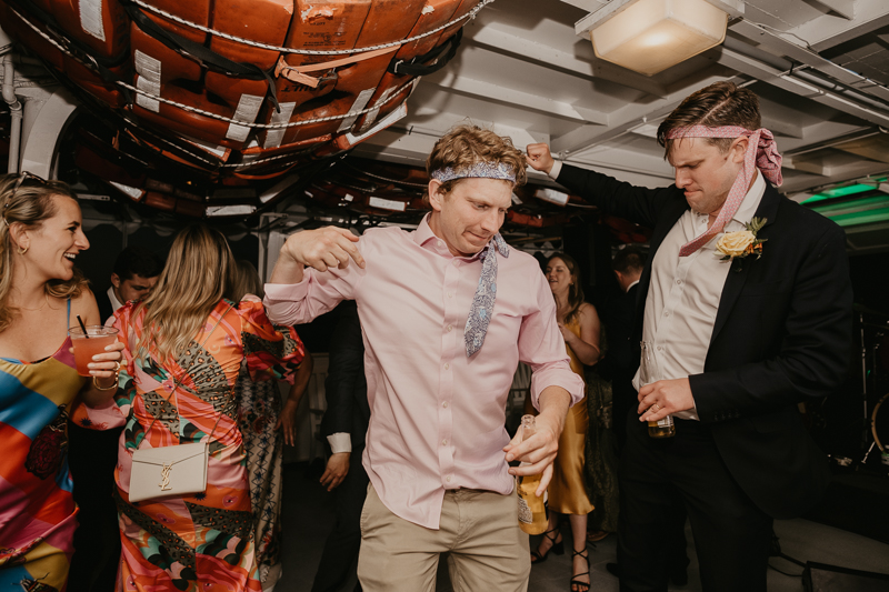 An exciting evening wedding reception by Watershed Entertainment and Timmie Metz Band on the Harbor Queen boat in Annapolis, Maryland by Britney Clause Photography