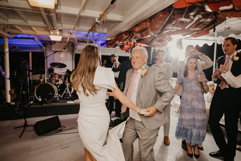 An exciting evening wedding reception by Watershed Entertainment and Timmie Metz Band on the Harbor Queen boat in Annapolis, Maryland by Britney Clause Photography