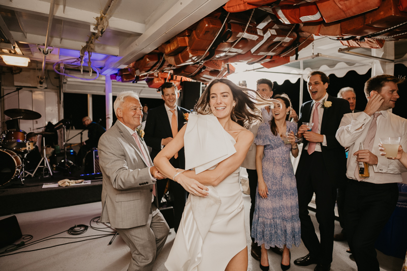 An exciting evening wedding reception by Watershed Entertainment and Timmie Metz Band on the Harbor Queen boat in Annapolis, Maryland by Britney Clause Photography