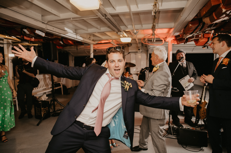 An exciting evening wedding reception by Watershed Entertainment and Timmie Metz Band on the Harbor Queen boat in Annapolis, Maryland by Britney Clause Photography