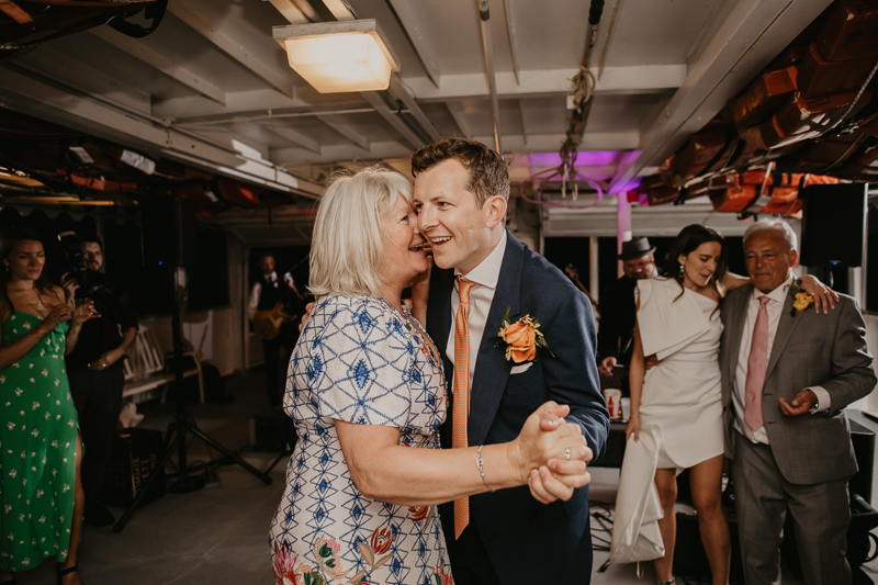 An exciting evening wedding reception by Watershed Entertainment and Timmie Metz Band on the Harbor Queen boat in Annapolis, Maryland by Britney Clause Photography