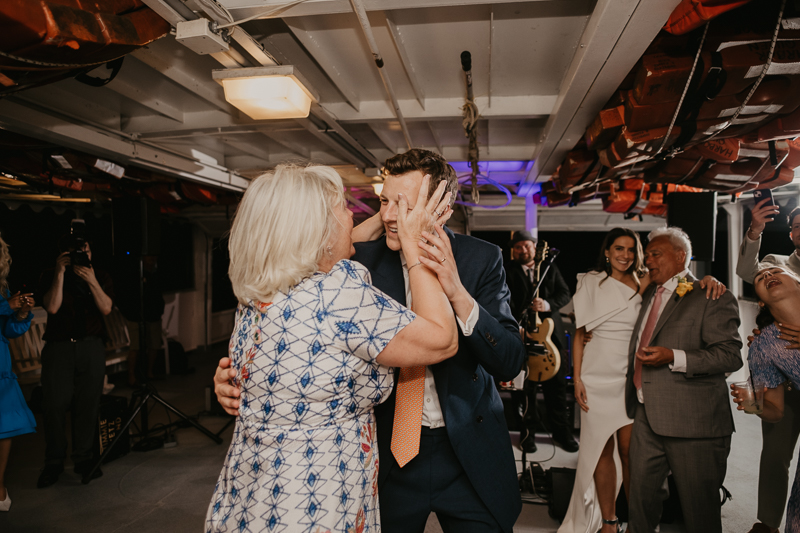 An exciting evening wedding reception by Watershed Entertainment and Timmie Metz Band on the Harbor Queen boat in Annapolis, Maryland by Britney Clause Photography