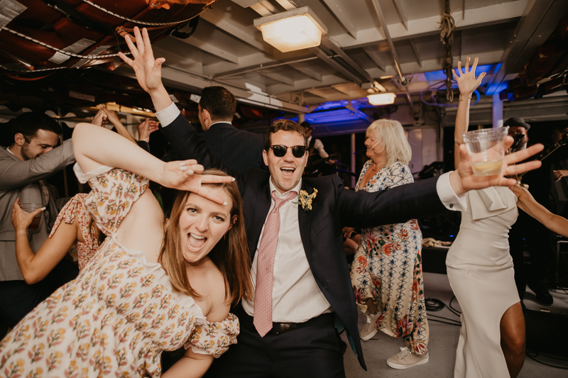 An exciting evening wedding reception by Watershed Entertainment and Timmie Metz Band on the Harbor Queen boat in Annapolis, Maryland by Britney Clause Photography