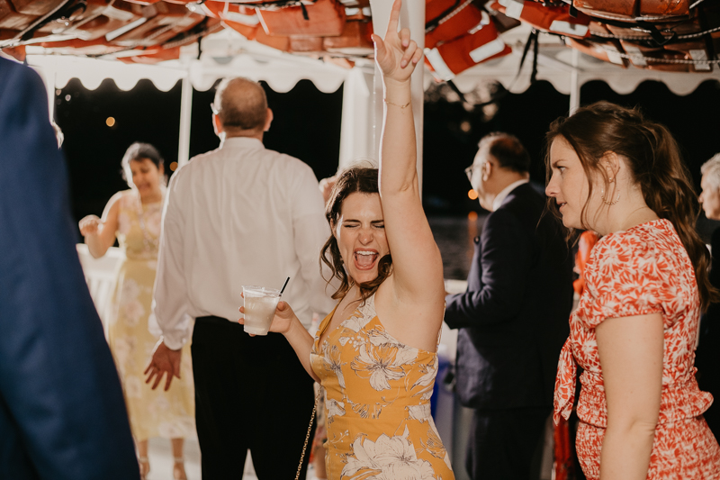 An exciting evening wedding reception by Watershed Entertainment and Timmie Metz Band on the Harbor Queen boat in Annapolis, Maryland by Britney Clause Photography