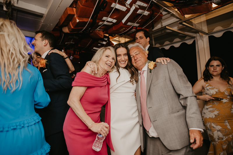 An exciting evening wedding reception by Watershed Entertainment and Timmie Metz Band on the Harbor Queen boat in Annapolis, Maryland by Britney Clause Photography