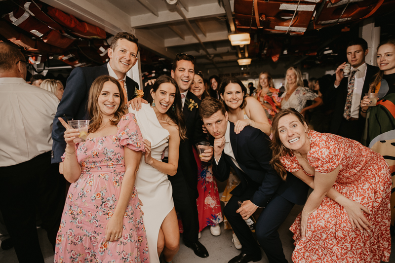 An exciting evening wedding reception by Watershed Entertainment and Timmie Metz Band on the Harbor Queen boat in Annapolis, Maryland by Britney Clause Photography