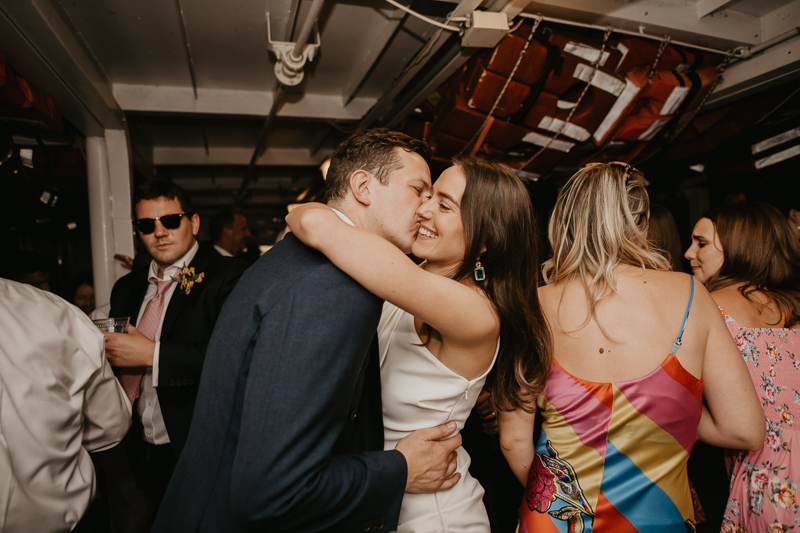 An exciting evening wedding reception by Watershed Entertainment and Timmie Metz Band on the Harbor Queen boat in Annapolis, Maryland by Britney Clause Photography