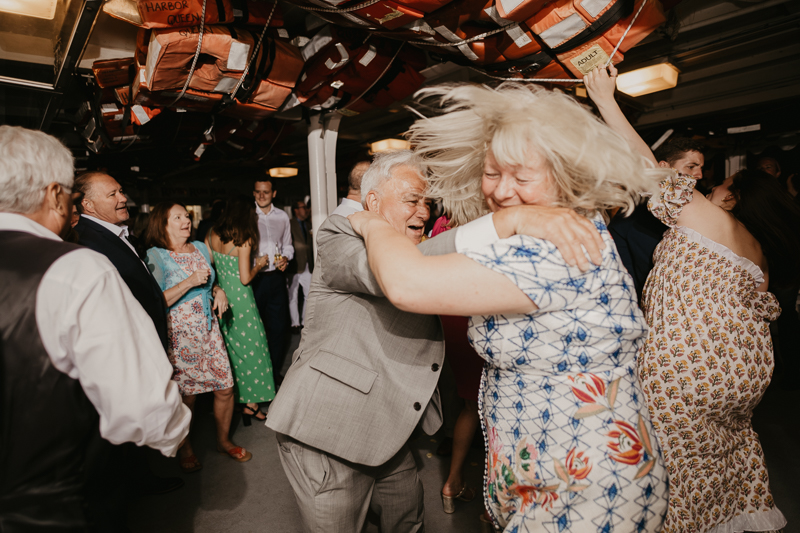 An exciting evening wedding reception by Watershed Entertainment and Timmie Metz Band on the Harbor Queen boat in Annapolis, Maryland by Britney Clause Photography